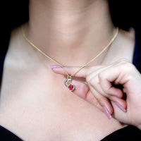 Natural 1.5 carat ruby and diamond infinity pendant on silver chain by Rosec Jewels, featuring a elegant pendant design.