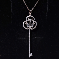Yellow vintage key pendant necklace with a certified moissanite gemstone from Rosec Jewels, showcasing intricate design and craftsmanship.