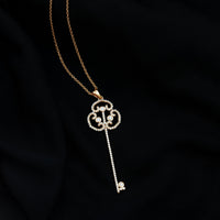 Vintage Moissanite key pendant necklace by Rosec Jewels featuring a sparkling moissanite gemstone on a delicate chain.