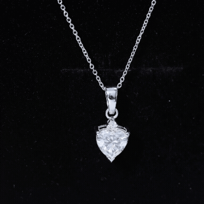 Silver heart-shaped cubic zirconia pendant with chain, featuring a Rosec Jewels certified locket design.