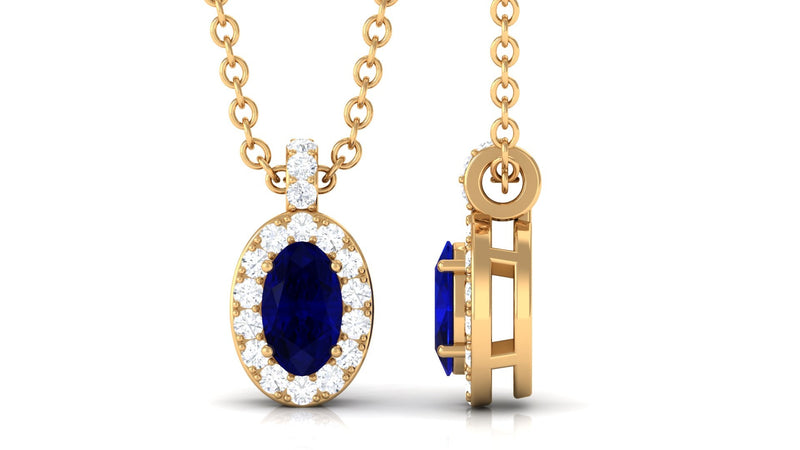Oval blue sapphire pendant necklace with diamond halo from Rosec Jewels, showcasing a 0.6 carat sapphire and sparkling diamond accents.