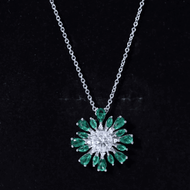 Rosec Jewels 1.3 Carat Moissanite flower pendant with lab emerald, showcasing sparkling gemstones and intricate floral design.
