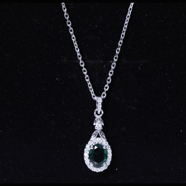 Lab grown emerald pendant necklace with silver chain, showcasing a 1.2 carat emerald in a Rosec Jewels pendant design.