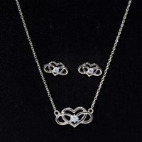 Round cut diamond infinity heart jewelry set by Rosec Jewels featuring sparkling diamonds and elegant design.
