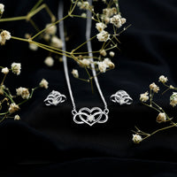 Round cut diamond infinity heart jewelry set by Rosec Jewels, featuring elegant diamond accents and intricate heart and infinity designs.