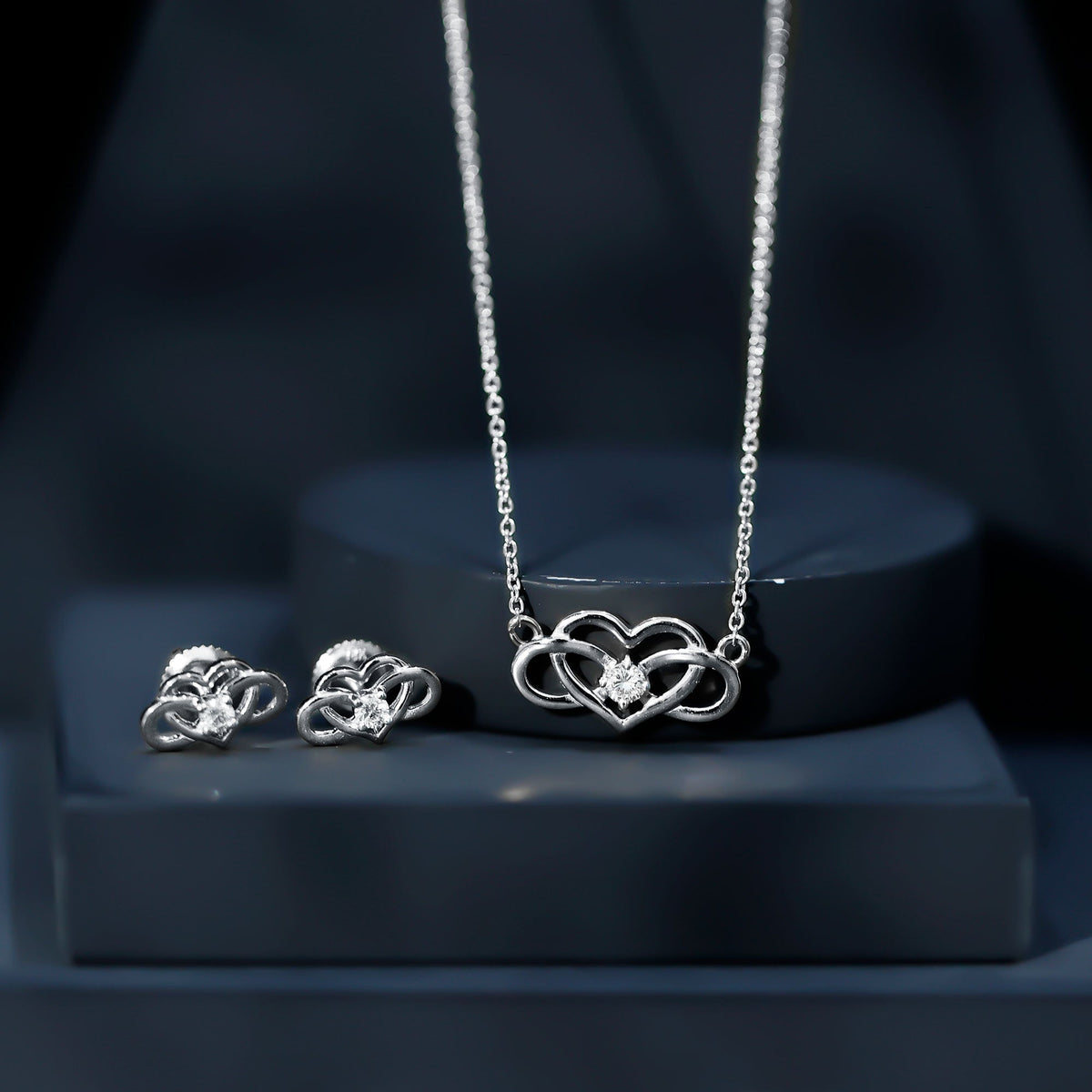 Round cut diamond infinity heart jewelry set featuring elegant design, crafted by Rosec Jewels with sparkling diamond accents.