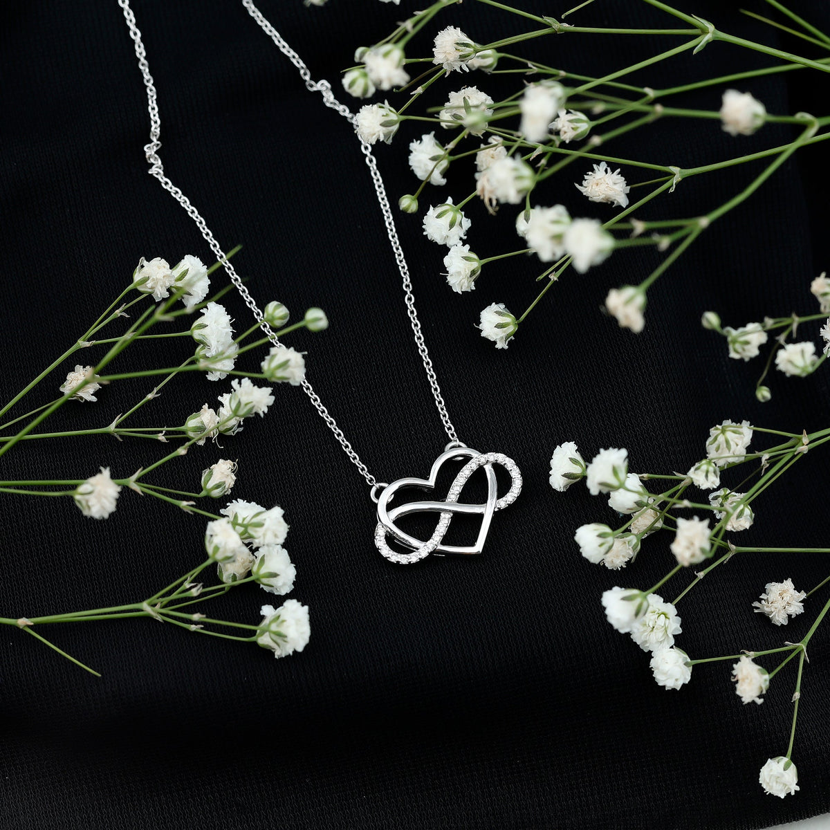 Rosec Jewels certified diamond infinity heart necklace featuring a sparkling diamond pendant on a delicate chain.