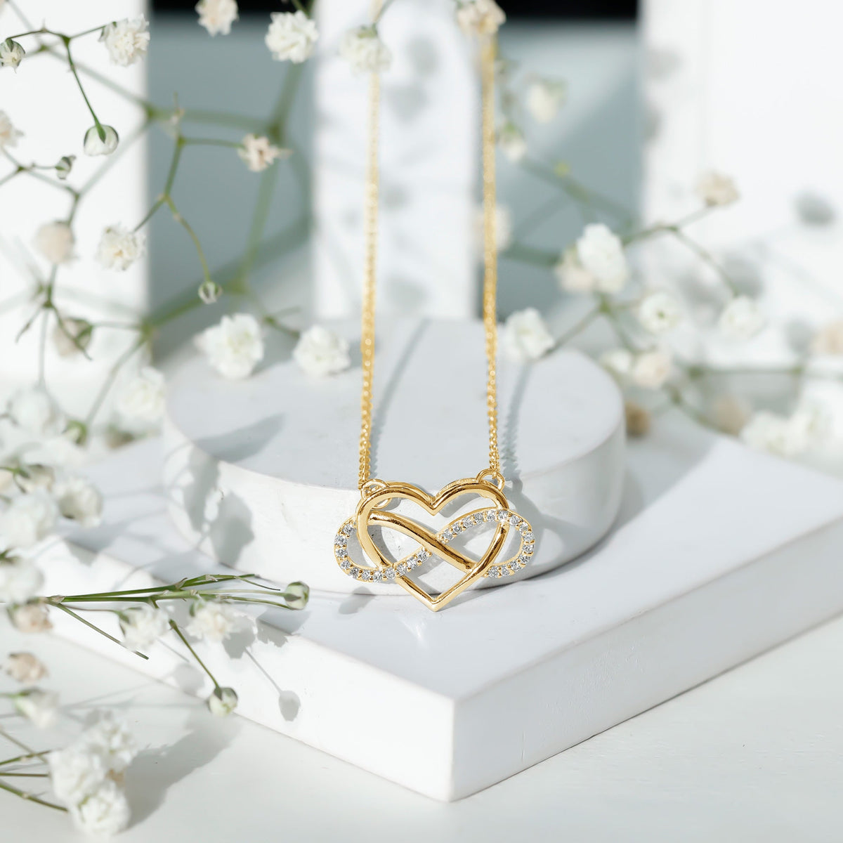 Sterling silver infinity heart necklace with certified diamonds by Rosec Jewels, featuring a delicate chain and sparkling pendant.