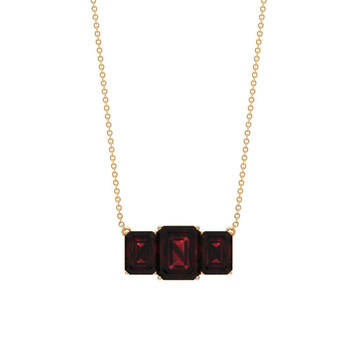 Emerald cut garnet three-stone pendant necklace by Rosec Jewels featuring 2-carat center gemstone and delicate chain.