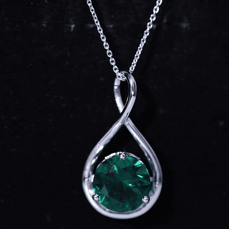 Rosec Jewels AAAA Grade 3.5 Carat lab-created emerald infinity pendant on a silver chain, close-up view of the elegant jewelry.