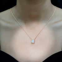 2 Carat princess cut Ethiopian opal solitaire necklace with rope frame by Rosec Jewels, featuring a vibrant, shimmering gemstone.