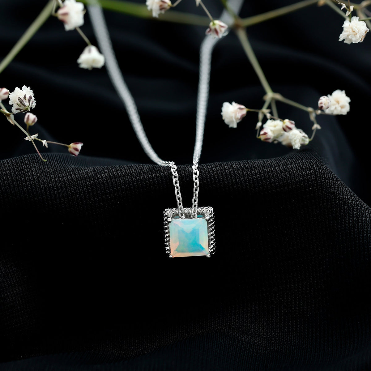 Ethiopian opal solitaire necklace with 2 carat princess cut stone and rope frame, featuring Rosec Jewels branding.