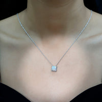 Ethiopian opal solitaire necklace with 2-carat princess cut stone and rope frame, by Rosec Jewels.