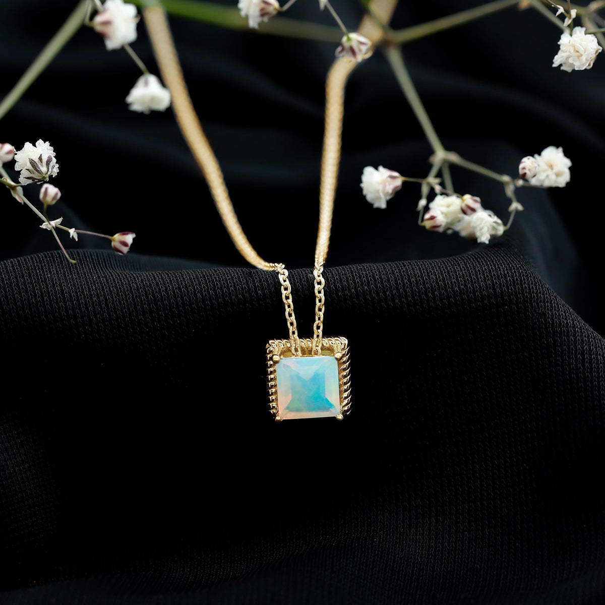 Ethiopian opal solitaire necklace with a princess cut 2 carat gemstone set in a rope frame by Rosec Jewels