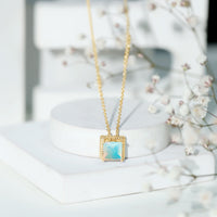 Ethiopian opal solitaire necklace with 2 carat princess cut stone and rope frame by Rosec Jewels.