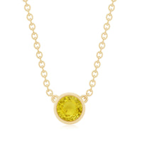 Round cut 4mm yellow sapphire bezel set pendant necklace from Rosec Jewels featuring a sparkling yellow sapphire gemstone.