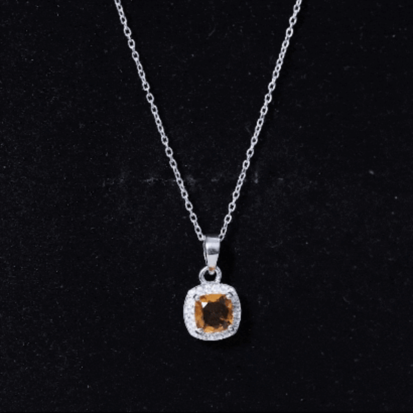 Cushion cut 1 carat citrine pendant necklace with moissanite halo, featuring a gold chain and elegant jewelry design.