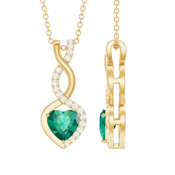 Lab grown emerald infinity heart pendant necklace with diamond accents, featuring a 1.3 carat emerald by Rosec Jewels.