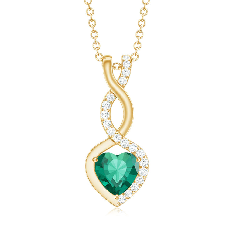 Lab grown emerald infinity heart pendant necklace with diamonds by Rosec Jewels, showcasing a 1.3 carat emerald and intricate design.