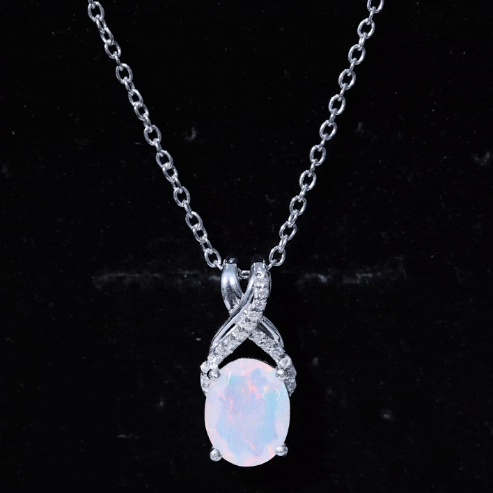 Oval rainbow opal solitaire pendant with moissanite, featuring a 8x10 mm oval gemstone, set in a delicate jewelry pendant.