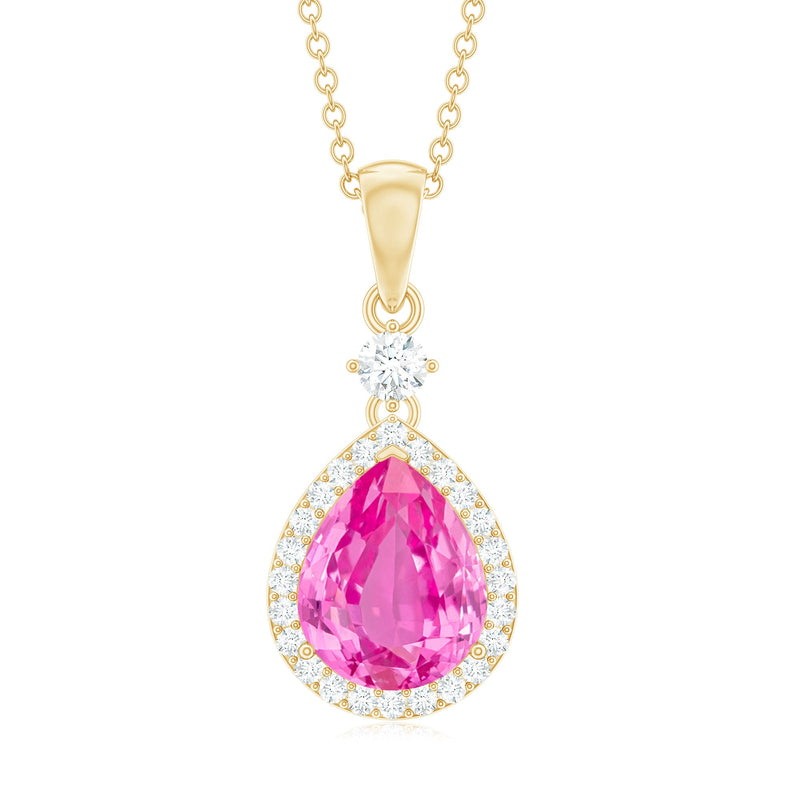 Pink sapphire teardrop pendant necklace with diamond halo from Rosec Jewels, featuring a sparkling pink gemstone and elegant design.