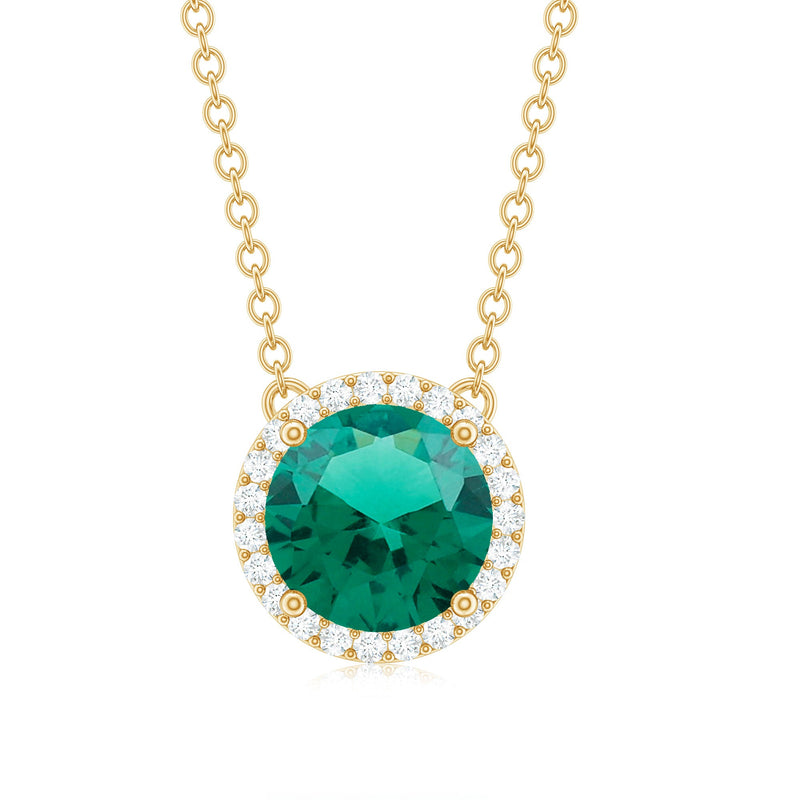 Round lab-created emerald and diamond halo pendant necklace featuring 2 carats, designed by Rosec Jewels.