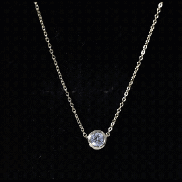 Yellow gold bezel set pendant featuring a 5mm round lab-grown diamond solitaire from Rosec Jewels.