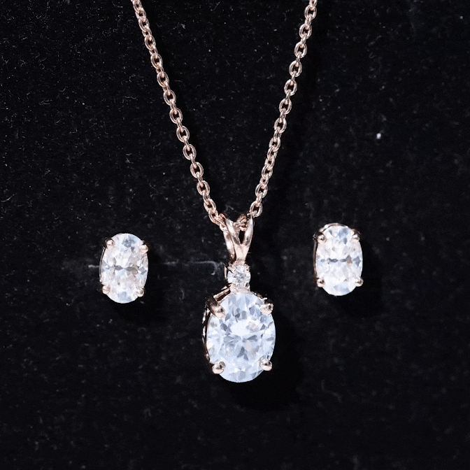 Oval-shaped lab-grown diamond bridal jewelry set by Rosec Jewels featuring yellow gold accents and sparkling diamonds.