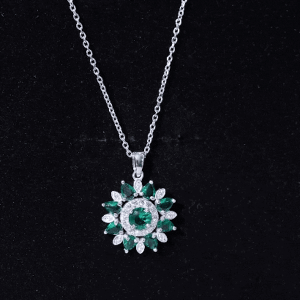 Lab created emerald and diamond flower pendant necklace featuring vibrant yellow accents by Rosec Jewels.