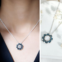 Rosec Jewels 2 Carat Moissanite statement pendant with London Blue Topaz halo, featuring a sparkling gemstone necklace.