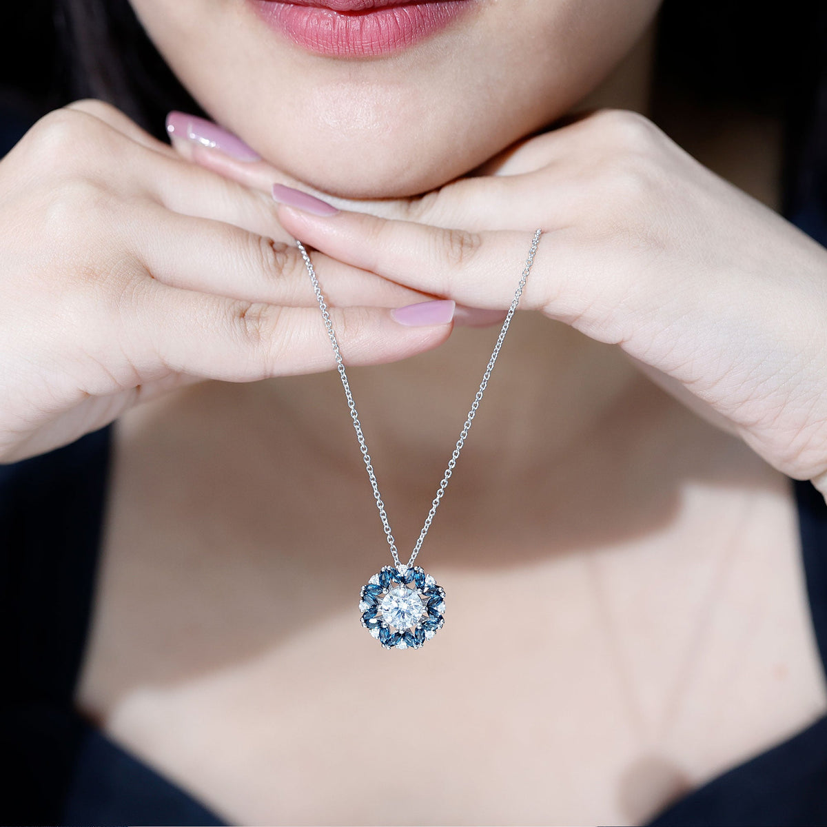 Elegant 2 carat moissanite statement necklace with a London Blue Topaz halo pendant, featuring a Rosec Jewels design.