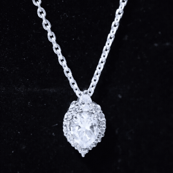 White moissanite teardrop pendant necklace from Rosec Jewels, certified 1.3 carats, ideal for weddings and special occasions.