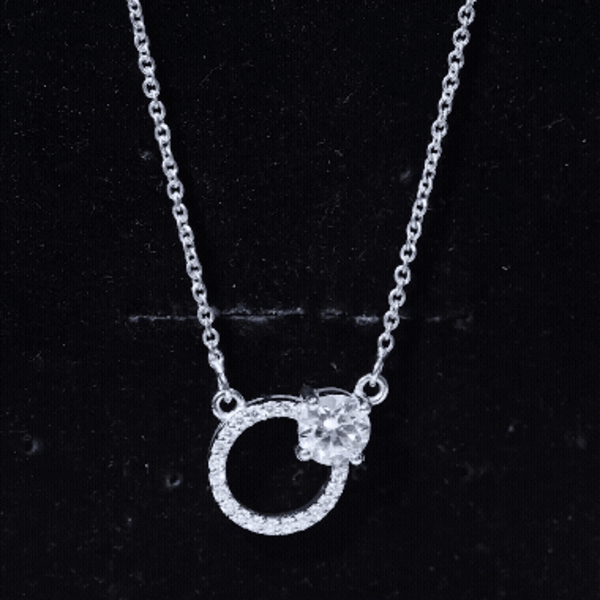 Silver circle necklace with a 6 mm round moissanite pendant from Rosec Jewels, showcasing a sleek and elegant jewelry design.