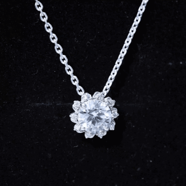 Round 2-carat moissanite sunburst pendant with silver chain from Rosec Jewels, showcasing a sparkling sunburst design.