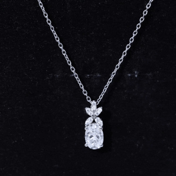 Oval-shaped moissanite flower pendant necklace with a 0.9 carat stone, featuring a delicate floral design by Rosec Jewels.