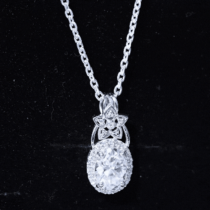 Vintage-inspired 2 carat moissanite halo pendant in 14k gold plated silver, featuring elegant craftsmanship and sparkling center stone.