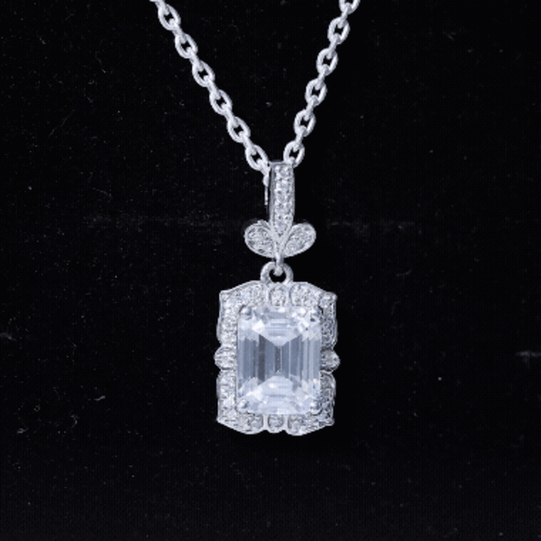 Vintage-inspired 2.8 carat moissanite emerald cut pendant with silver chain, featuring a Rosec Jewels pendant design.