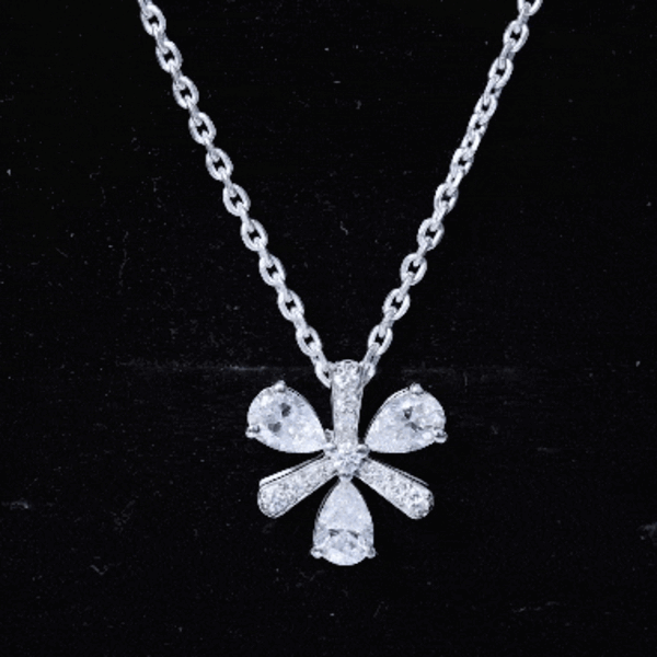 Certified moissanite flower pendant necklace with silver chain, showcasing a sparkling flower design from Rosec Jewels.