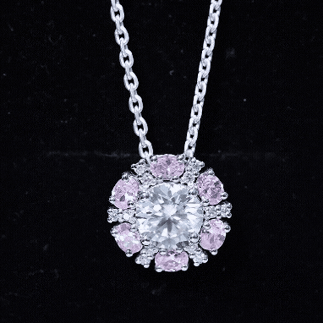 Rosec Jewels flower pendant necklace with 2 CT moissanite and lab-grown pink sapphire, featuring a delicate floral design.