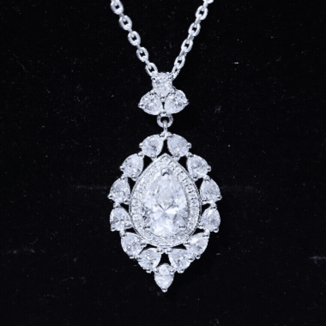 Pear-shaped 2.2 carat moissanite pendant with silver chain, crafted by Rosec Jewels, featuring a sparkling bridal necklace design.