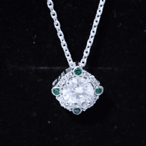 Vintage-inspired Rosec Jewels 2 Carat Moissanite pendant featuring a lab emerald gemstone on a delicate chain.