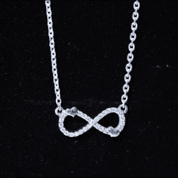 Certified Moissanite infinity heart pendant in 14K gold plated silver featuring a sparkling heart-shaped moissanite stone.