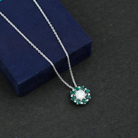 Certified 2 Carat Moissanite and Lab Emerald Flower Necklace in Silver