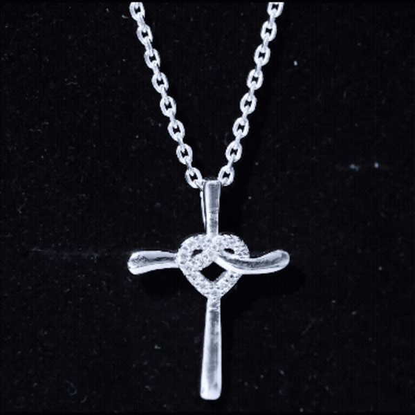 Silver chain necklace with a certified moissanite cross and heart pendant from Rosec Jewels, showcasing sparkling jewelry design.