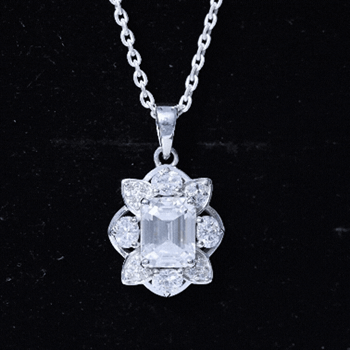 Elegant rose gold pendant featuring a 2.8 carat emerald cut moissanite with a silver chain from Rosec Jewels.