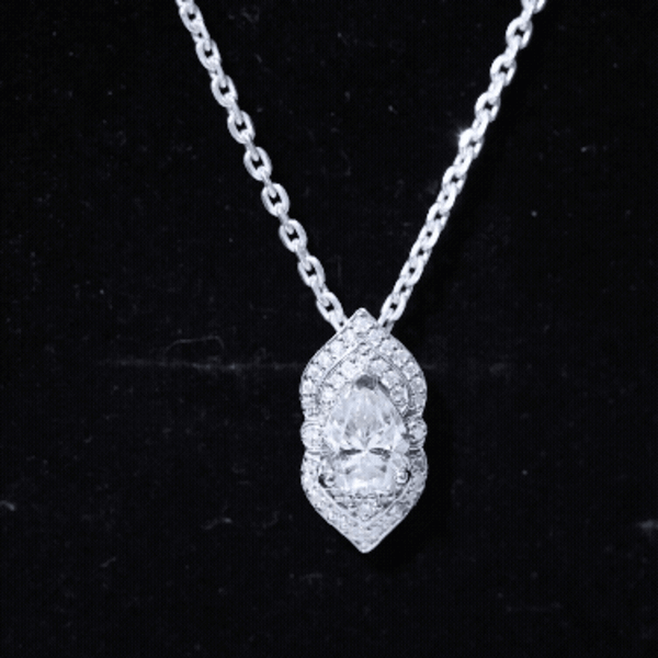 Pear-shaped moissanite vintage pendant with silver chain, 1.3 carats, elegant jewelry piece by Rosec Jewels.