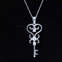 Vintage-inspired cubic zirconia key pendant necklace by Rosec Jewels featuring a sparkling white zirconia stone and detailed design.