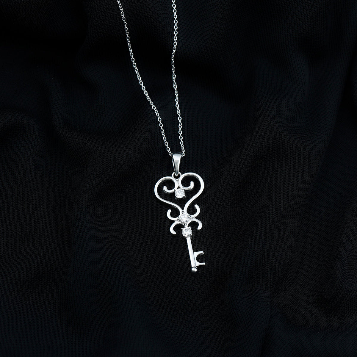Vintage-inspired cubic zirconia key pendant necklace by Rosec Jewels featuring sparkling stones and detailed design.