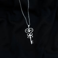 Vintage-inspired cubic zirconia key pendant necklace by Rosec Jewels featuring sparkling stones and detailed design.