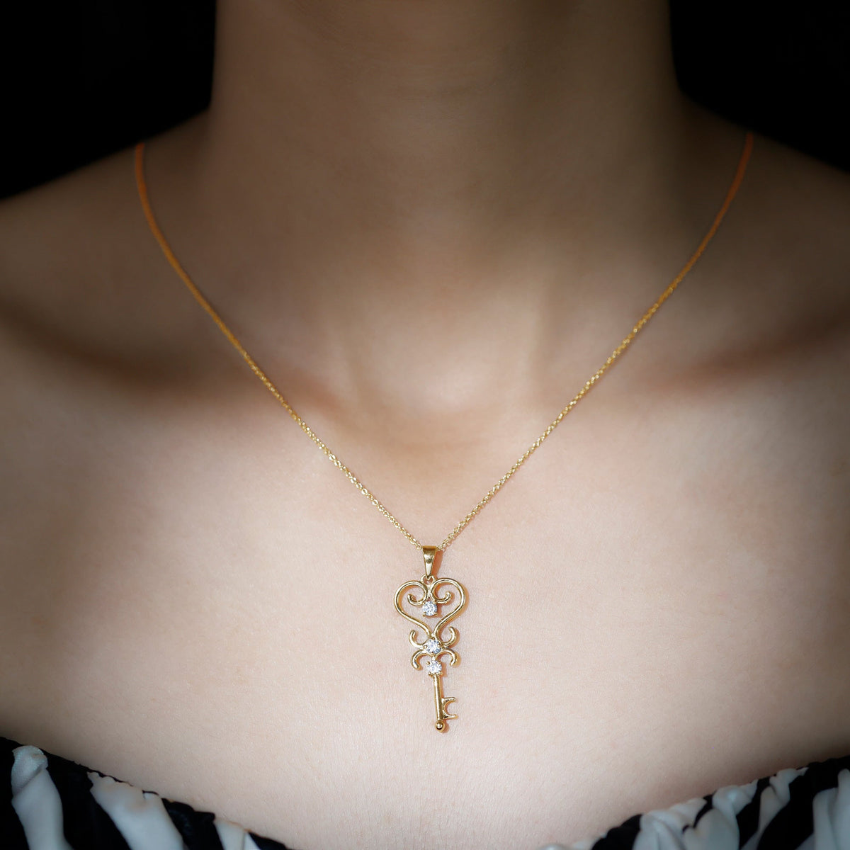 Vintage-inspired cubic zirconia key pendant necklace by Rosec Jewels, featuring sparkling stones and a detailed design.